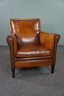 Art Deco Sessel mit schwarzen Paspeln und Ziernägeln