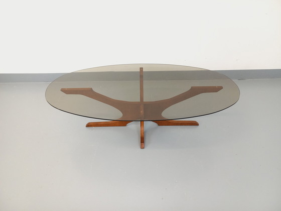 Image 1 of Vintage Hugues Poignant Ovaler Couchtisch aus Teakholz und Rauchglas aus den 1960er und 1970er Jahren