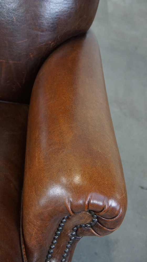 Image 1 of Dunkler Schafsfell-Sessel auf Rädern