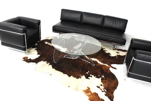 As new, sculptural italian coffee table with glass top and acrylic base