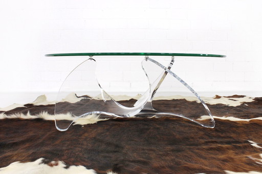 As new, sculptural italian coffee table with glass top and acrylic base