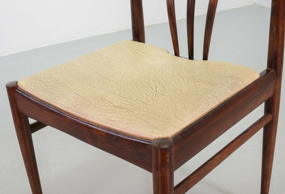 Image 1 of Skandinavisch Esszimmerstühle mit Spindelrücken aus massivem Palisanderholz und karamellfarbenem Kunstlederbezug. Vierer-Set, Ja